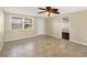 Spacious living room featuring tile floors, neutral paint, and a ceiling fan at 1533 Olympia Rd, Venice, FL 34293