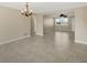 Bright living area featuring tile flooring, open layout, and natural light at 1533 Olympia Rd, Venice, FL 34293