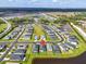 Aerial view of the neighborhood and surrounding lakes showing the property location and nearby amenities at 16411 62Nd E Gln, Parrish, FL 34219