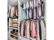 A walk-in closet includes custom shelving, hanging rods, and shoe racks for optimal storage at 16411 62Nd E Gln, Parrish, FL 34219
