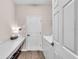 The laundry room includes a long countertop, storage under the counter, and modern appliances at 16411 62Nd E Gln, Parrish, FL 34219
