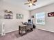 Comfortable home office with a rustic wooden desk, neutral walls, and a bright window at 16411 62Nd E Gln, Parrish, FL 34219