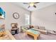 Inviting playroom with comfortable seating, a ' table, and a variety of toys for creative play at 16411 62Nd E Gln, Parrish, FL 34219