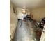 Unfinished basement with concrete floors, cluttered space, and access to the backyard at 1909 6Th W Ave, Palmetto, FL 34221