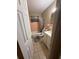 Modest bathroom with a vanity and a retro pink tile surround at 1909 6Th W Ave, Palmetto, FL 34221