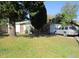 Modest single story home with lawn, mature trees and landscaping at 1909 6Th W Ave, Palmetto, FL 34221