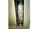HVAC closet featuring a modern air conditioning unit with attached duct work and plumbing at 1909 6Th W Ave, Palmetto, FL 34221