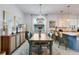 Bright and airy dining area with stylish decor and seating for six, great for entertaining at 19801 Fishhawk Trl, Venice, FL 34293