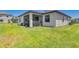An exterior view showcases the home's well-maintained lawn and screened lanai, perfect for outdoor enjoyment at 19801 Fishhawk Trl, Venice, FL 34293