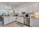 Bright kitchen showcasing granite countertops, stainless steel appliances, and ample cabinet space at 19801 Fishhawk Trl, Venice, FL 34293