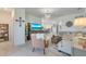 Bright, open living room with tile floors, a modern chandelier and stylish decor provides a relaxing ambiance at 19801 Fishhawk Trl, Venice, FL 34293