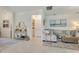 Bright living room featuring a comfortable sofa, stylish decor, and easy access to other areas of the home at 19801 Fishhawk Trl, Venice, FL 34293