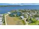 Stunning aerial view of waterfront homes and a sprawling blue bay, showcasing the beautiful coastal community at 217 22Nd Street Ne Ct, Bradenton, FL 34208