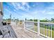 The outdoor deck features white railings, serene views, and comfortable seating areas at 217 22Nd Street Ne Ct, Bradenton, FL 34208