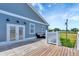 This outdoor deck features white railings and steps leading into the backyard at 217 22Nd Street Ne Ct, Bradenton, FL 34208