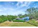 Picturesque waterfront backyard with a private dock and boat lift, perfect for enjoying scenic views and water activities at 217 22Nd Street Ne Ct, Bradenton, FL 34208