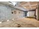Partially finished basement with concrete walls and floors offers potential for a variety of uses at 217 22Nd Street Ne Ct, Bradenton, FL 34208