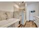 Luxurious bathroom featuring a soaking tub and walk-in shower with stylish tile work at 217 22Nd Street Ne Ct, Bradenton, FL 34208
