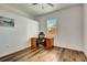 Bright bedroom features wood floors, a window, and a built in desk, creating a modern and functional living space at 217 22Nd Street Ne Ct, Bradenton, FL 34208