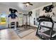 Spacious home gym featuring workout equipment, mirrors, and sports memorabilia at 217 22Nd Street Ne Ct, Bradenton, FL 34208