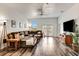Inviting living room with a large sectional, wood floors, and natural light from the sliding door at 217 22Nd Street Ne Ct, Bradenton, FL 34208