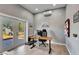 Bright home office with a glass door, desk setup, and modern decor at 217 22Nd Street Ne Ct, Bradenton, FL 34208