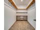 Spacious walk-in closet features carpet floors and custom wood shelving for organization at 217 22Nd Street Ne Ct, Bradenton, FL 34208