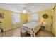 Bright bedroom with wood floors, comfortable queen bed, and natural lighting at 217 High Point Dr # 217A, Englewood, FL 34223