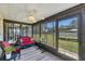 Relaxing screened-in porch with comfortable seating and clear views of the well-manicured backyard at 217 High Point Dr # 217A, Englewood, FL 34223
