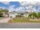 Inviting single-story home featuring a well-manicured lawn, attached garage, and pleasant curb appeal at 2402 33Rd W St, Bradenton, FL 34205