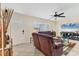 Comfortable living room featuring tile floors, a ceiling fan, and neutral wall paint at 2402 33Rd W St, Bradenton, FL 34205