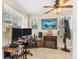 Home office features tile floors, natural light, ceiling fan, built-in desk, and decorative accents at 2402 33Rd W St, Bradenton, FL 34205