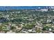 Expansive aerial view showcasing the property's location within a lush, established neighborhood near the waterfront at 2516 Goldenrod St, Sarasota, FL 34239
