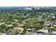 Aerial view of a charming home nestled within a lush, tree-filled neighborhood near Sarasota at 2516 Goldenrod St, Sarasota, FL 34239