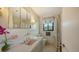 Retro bathroom features a pastel sink and tile, a tub and shower, and natural lighting at 2516 Goldenrod St, Sarasota, FL 34239
