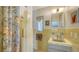Well-lit bathroom with unique tilework and ample vanity space at 2516 Goldenrod St, Sarasota, FL 34239