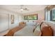 Cozy bedroom featuring modern decor, large windows, and ceiling fan at 2516 Goldenrod St, Sarasota, FL 34239