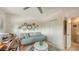 Comfortable bedroom with a daybed, closet, and an adjacent bathroom at 2516 Goldenrod St, Sarasota, FL 34239