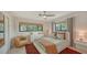 Comfortable bedroom with large windows, a ceiling fan, and stylish furniture at 2516 Goldenrod St, Sarasota, FL 34239