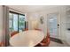 Bright dining area featuring a modern light fixture and access to an outdoor patio area at 2516 Goldenrod St, Sarasota, FL 34239