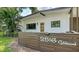 Inviting exterior view featuring a contemporary design with a bright door and verdant landscaping at 2516 Goldenrod St, Sarasota, FL 34239