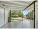 Well-lit garage space with ample room, featuring exposed beams and access to the outdoors for added convenience at 2516 Goldenrod St, Sarasota, FL 34239