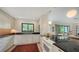 Well-lit kitchen with modern appliances, granite countertops, and stylish cabinetry at 2516 Goldenrod St, Sarasota, FL 34239
