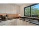 Bright kitchen featuring granite countertops, updated cabinets, and stainless steel sink and faucet at 2516 Goldenrod St, Sarasota, FL 34239
