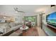 Spacious living room showcasing an open concept design with a breakfast bar and view of the kitchen at 2516 Goldenrod St, Sarasota, FL 34239