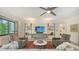 Bright living room showcasing contemporary furnishings, a ceiling fan, and an entertainment area at 2516 Goldenrod St, Sarasota, FL 34239