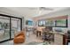 Bright office area with a dedicated workspace, outside views, and comfortable seating at 2516 Goldenrod St, Sarasota, FL 34239