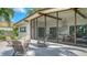 A beautiful outdoor living space including a screened-in porch and an open patio for relaxing and entertaining at 2516 Goldenrod St, Sarasota, FL 34239