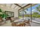 Inviting screened patio features seating, views of the yard, and indoor-outdoor living at 2516 Goldenrod St, Sarasota, FL 34239