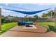 Outdoor seating area with blue shade sail, perfect for relaxation and entertainment at 2715 Herwald St, Sarasota, FL 34231